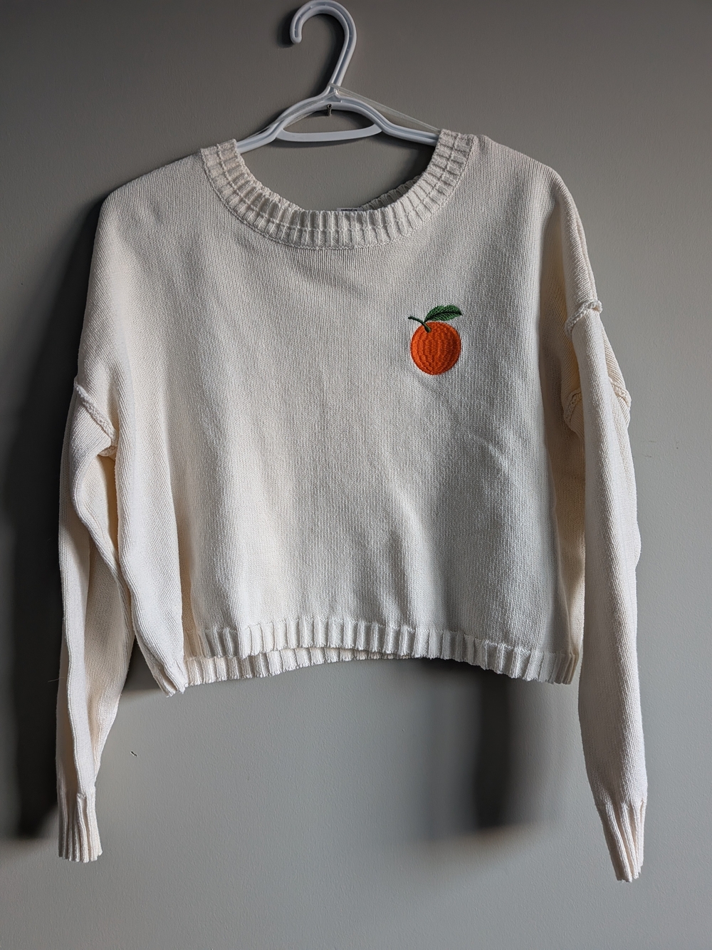 Sincerely Jules Cream Cropped Sweater with Embroidered Orange Motif